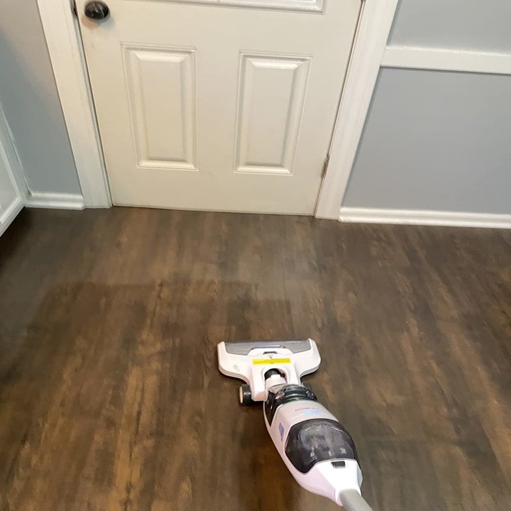 reviewer photo showing clean streaks from the washing capability on hardwood floor