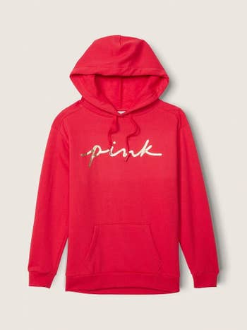 the hoodie in red with gold scrip writing that says 