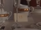 A close-up of the table card that says 13