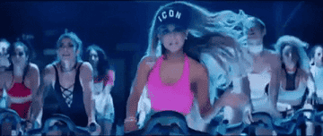 ariana grande on an exercise bike in the &quot;side to side&quot; video