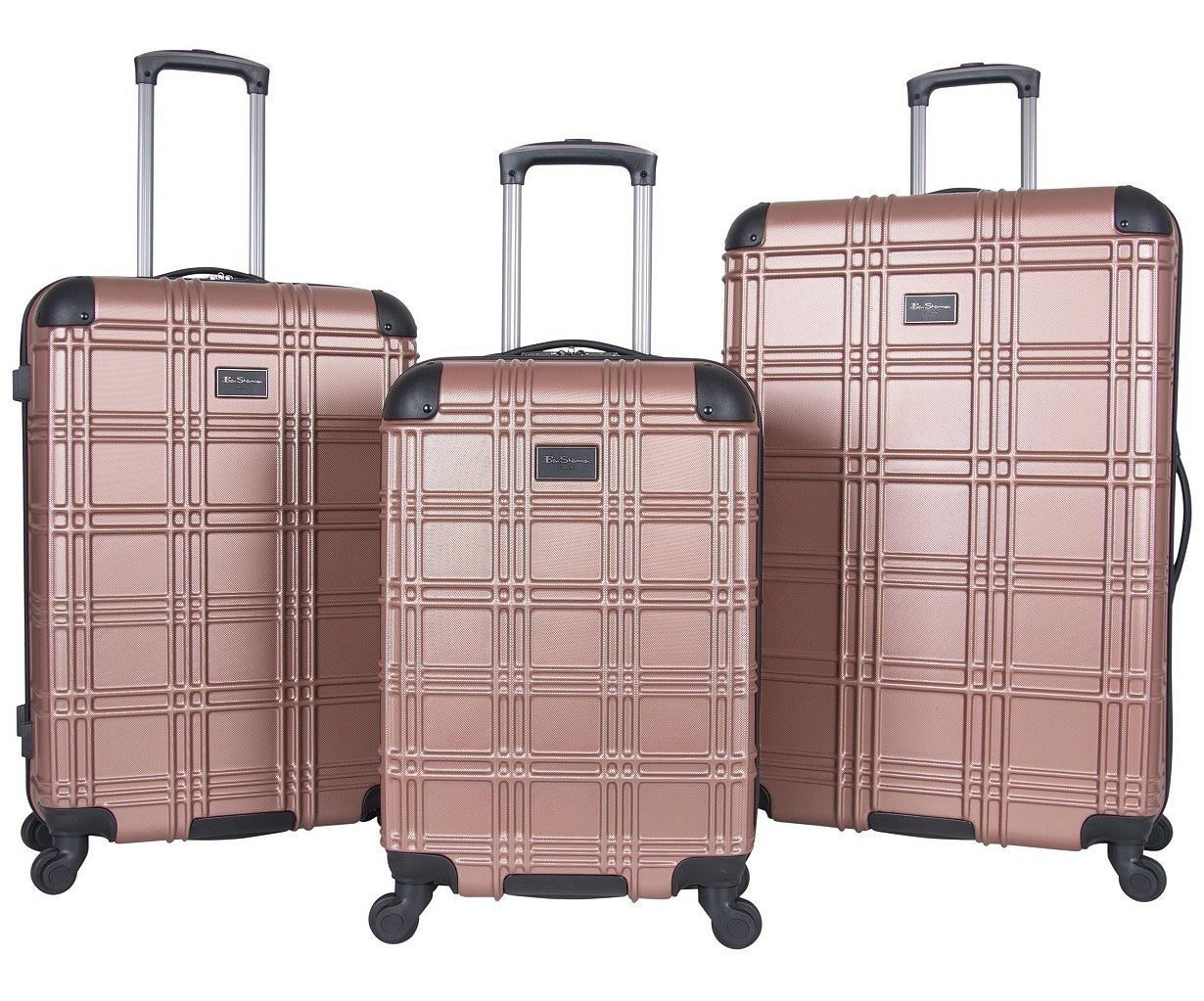three hard shell rose gold luggage set