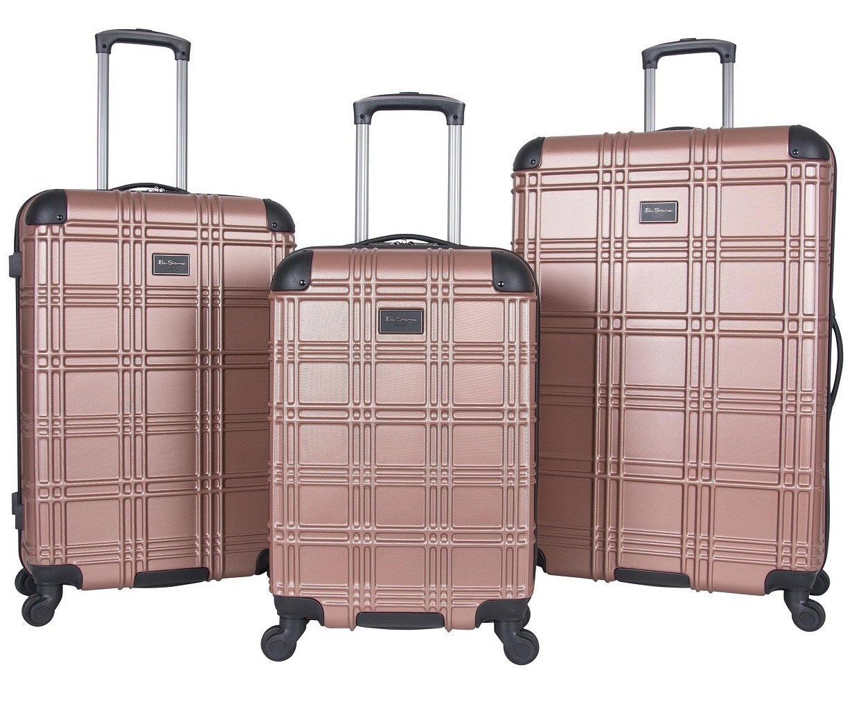 three hard shell rose gold luggage set