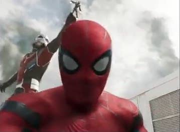 Spider-Man talking to his camera with Giant-Man grabbing War Machine in the background in &quot;Spider-Man: Homecoming&quot;