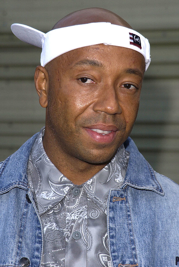 russell simmons with an upside down visor