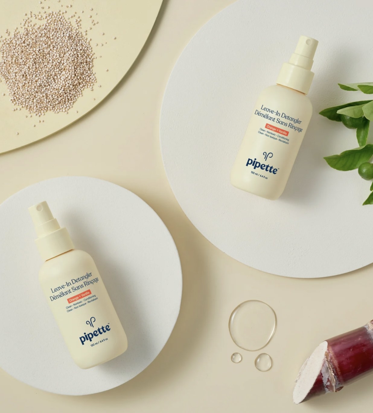 two bottles of the hair detangler in a flat lay