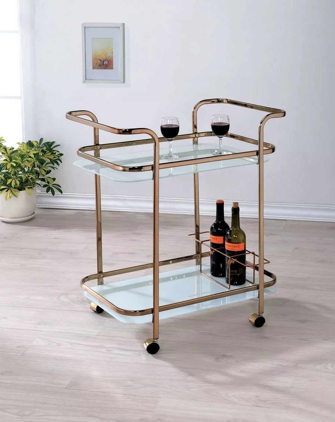 The champagne metal and glass rolling cart