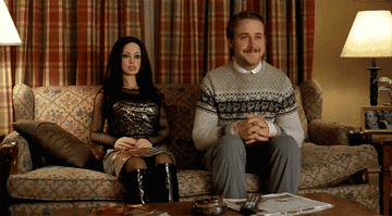 A scene from &quot;Lars and the Real Girl&quot; where Ryan Gosling is seated next to a fully dressed sex doll