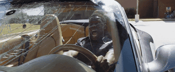 Kevin Hart driving backward and screaming