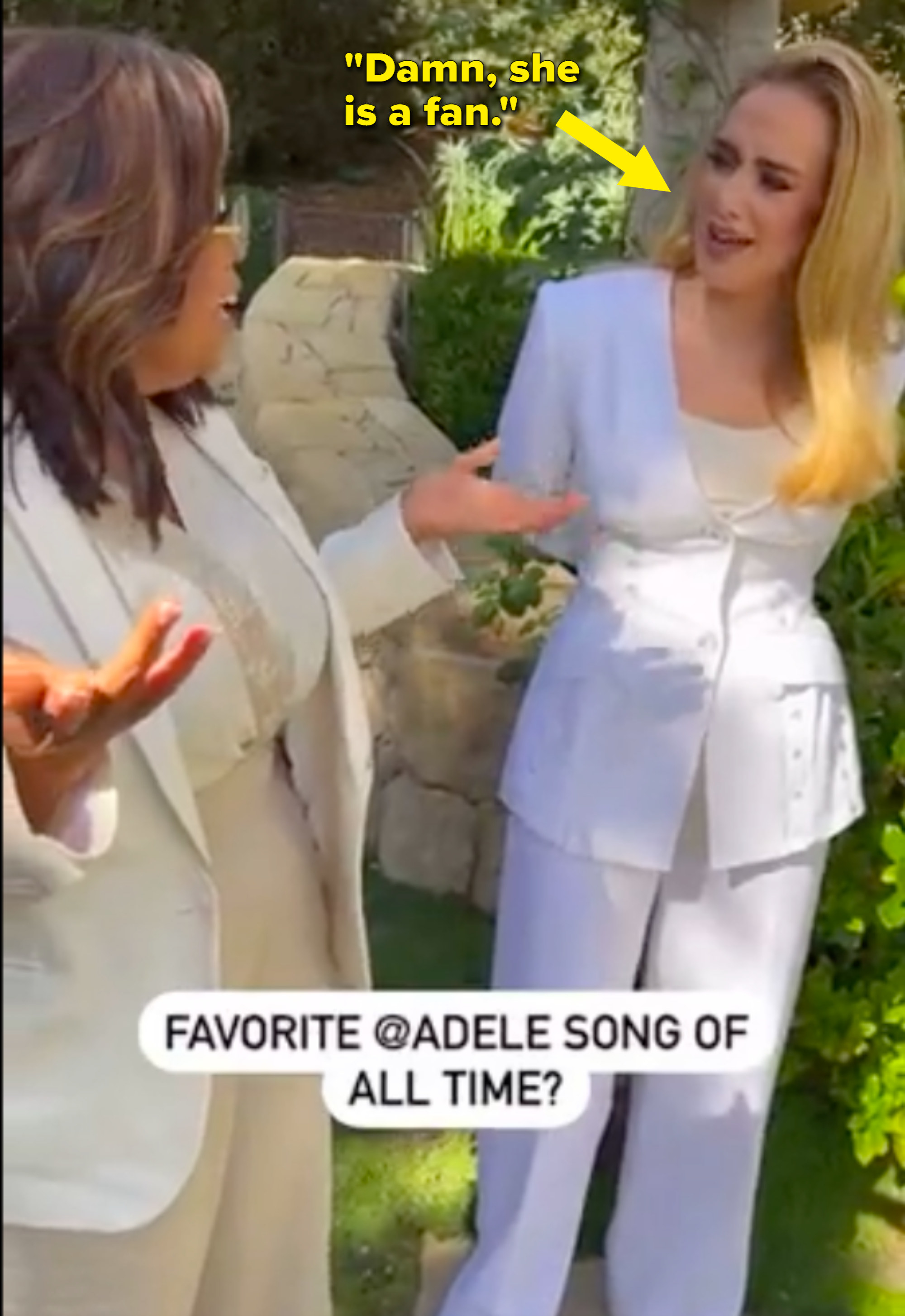 Oprah and Adele standing next to each other during an interview with a thought bubble next to the singer that says &quot;Damn, she is a fan...&quot;