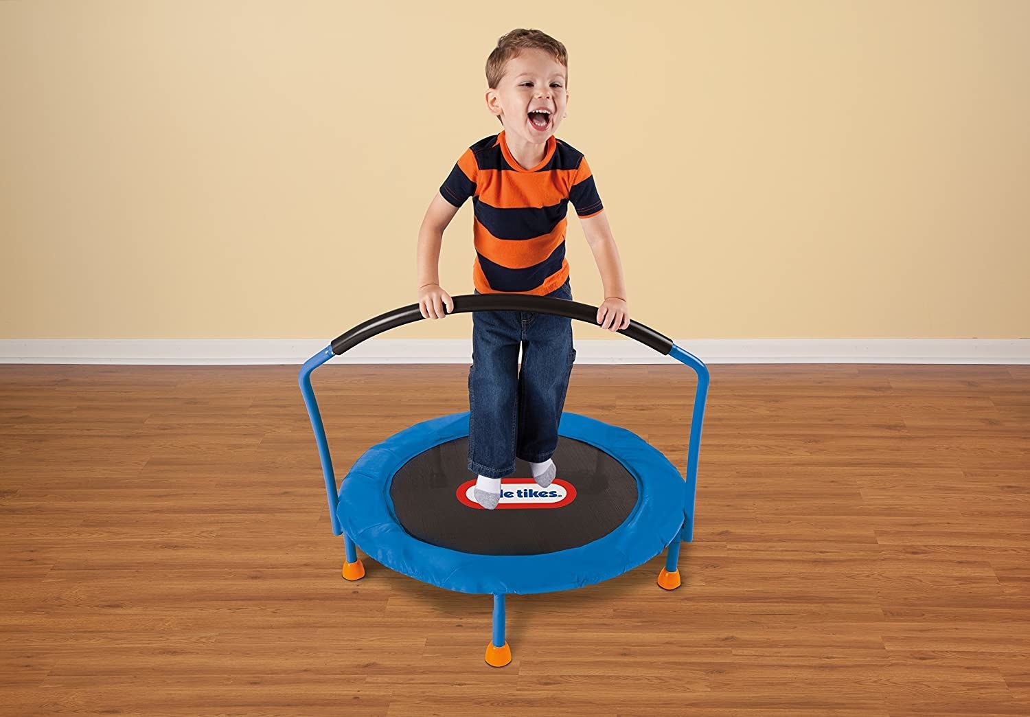 A child bouncing on a small trampoline