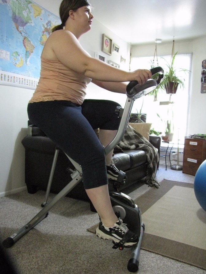 reviewer using exercise bike
