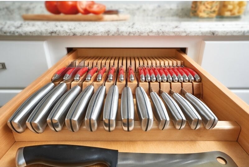 The knife drawer organizer with a knife in every slot