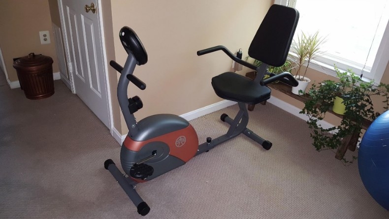exercise bike with full padded saddle chair