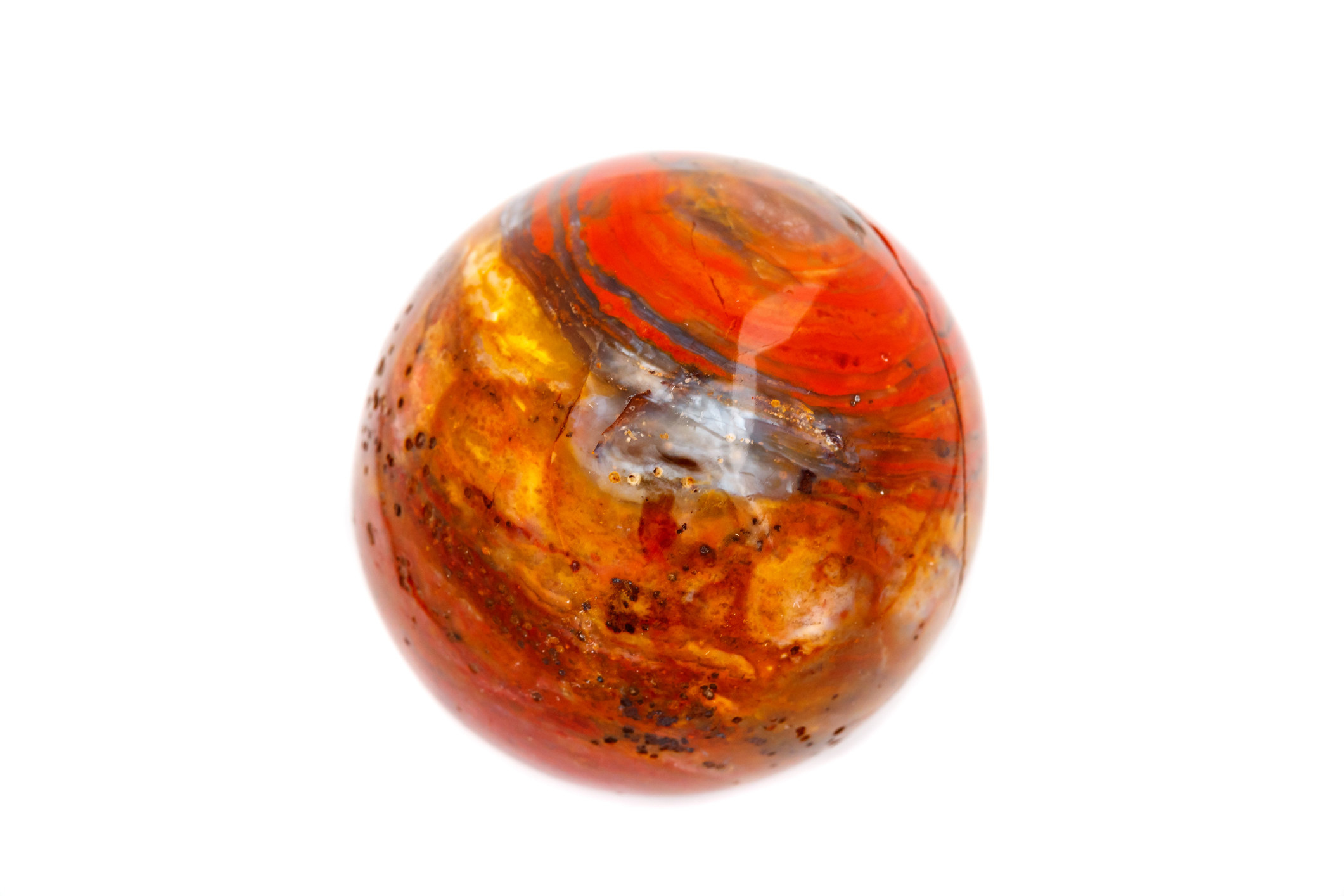 Macro mineral stone jasper ball on white background close up