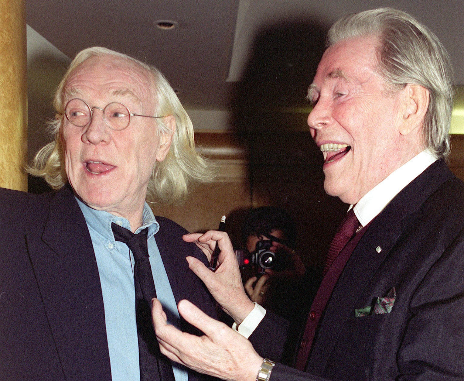 Peter and Richard laugh while at an event together