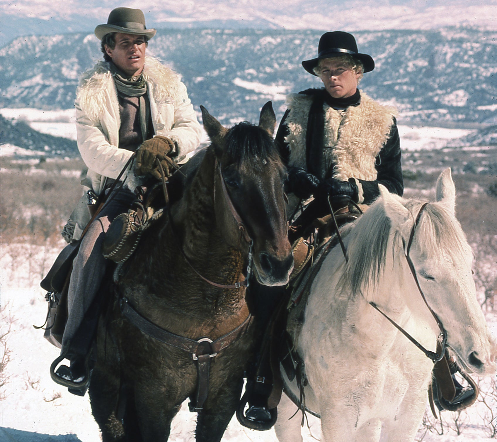 Publicity image of Tom Berenger and William Katt on horses