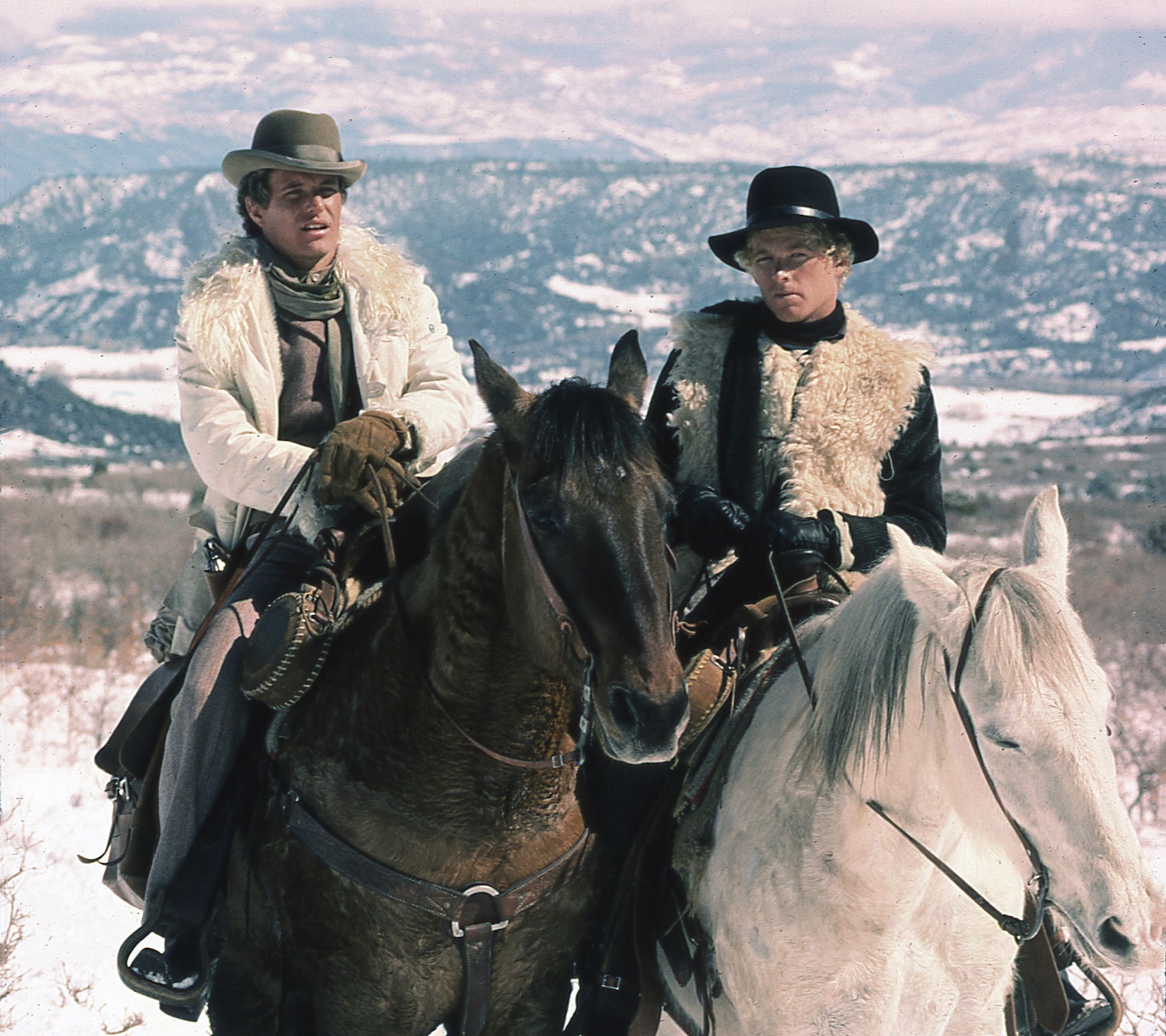 Publicity image of Tom Berenger and William Katt on horses