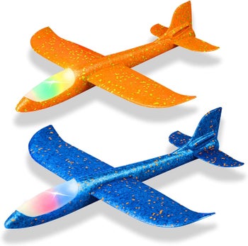 Two lit up planes in blue and orange
