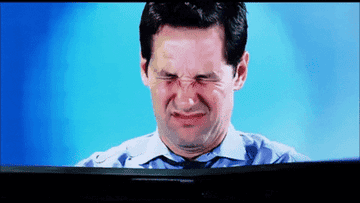 Gif of Paul Rudd scrunching up his face and closing his eyes in disgust