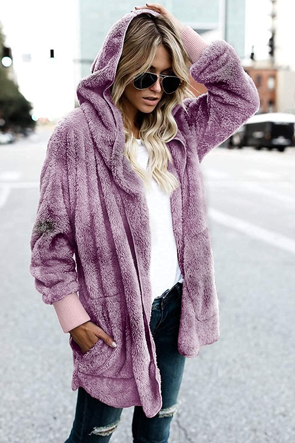 a person wearing the fuzzy cardigan