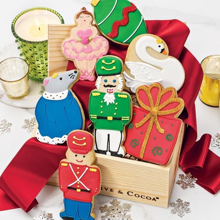 rat, soldier, nutcracker, ballerina, gift, swan, and ornament cookie in a big box
