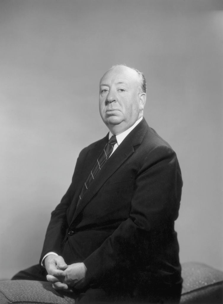 Alfred Hitchcock sitting for a portrait