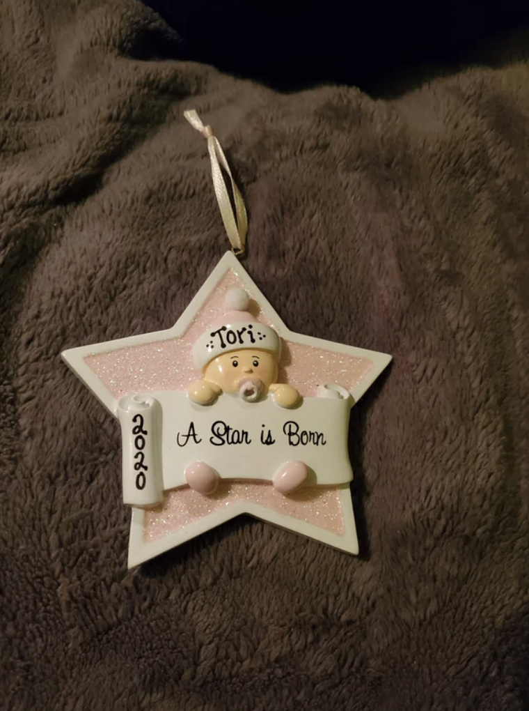 A Christmas ornament that says: &quot;A Star is Born, 2020&quot;