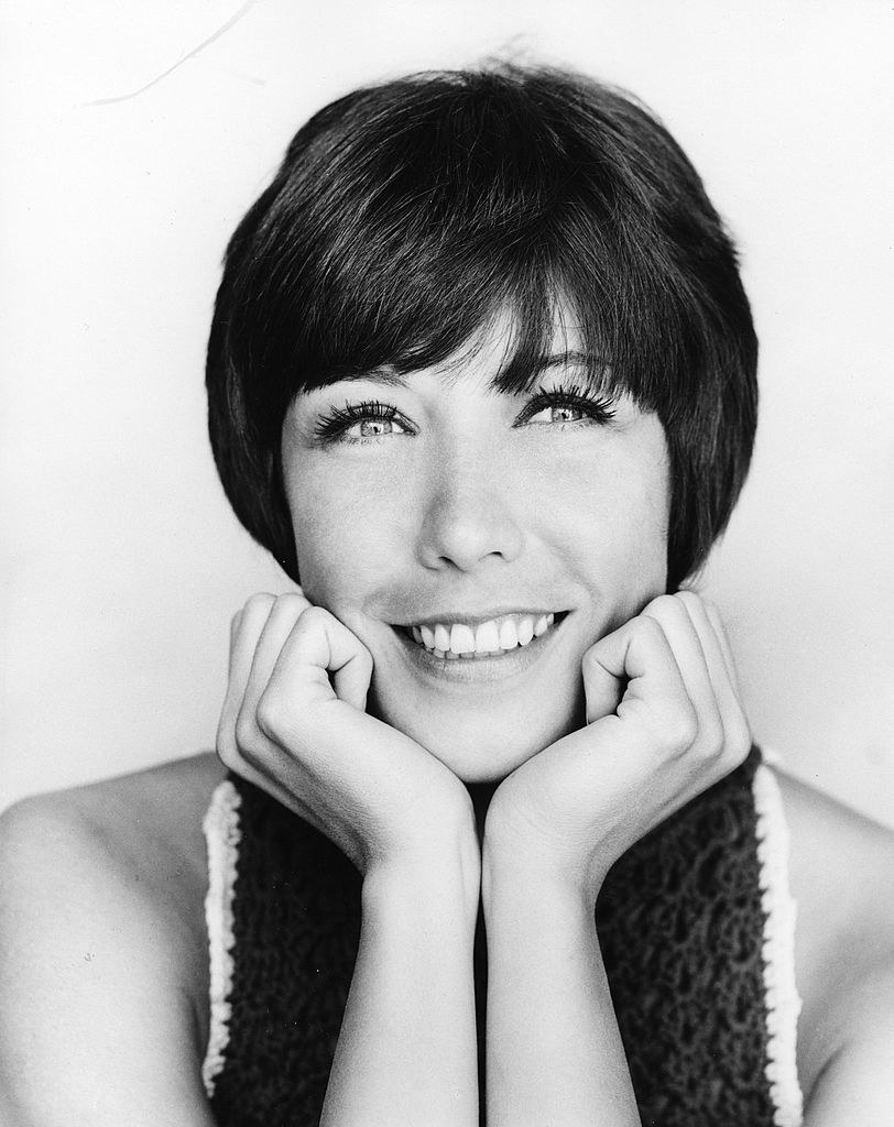 Lily Tomlin in 1969 with her hands on her face