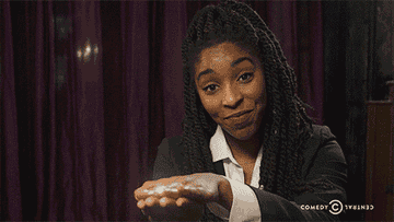 Jessica Williams opening her hands with a rainbow appearing from &#x27;The Daily Show&#x27;
