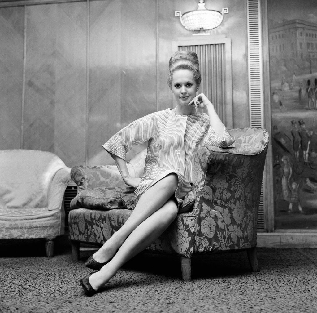 Tippi Hedren posing in a formal lounge