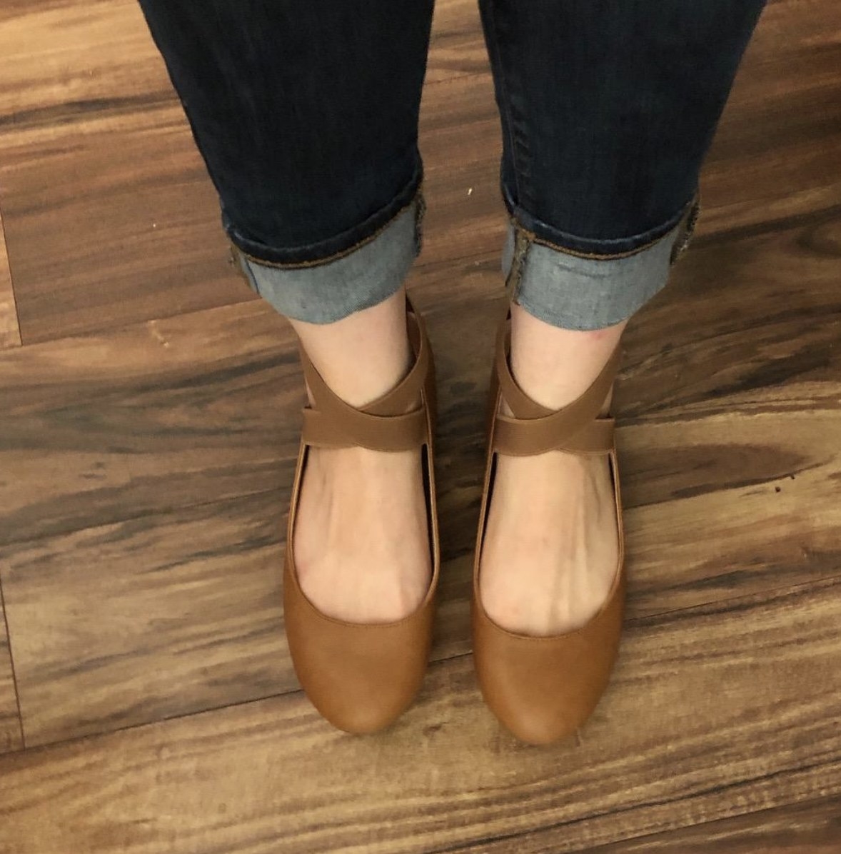 Tan ballet flats with straps on the around the ankles