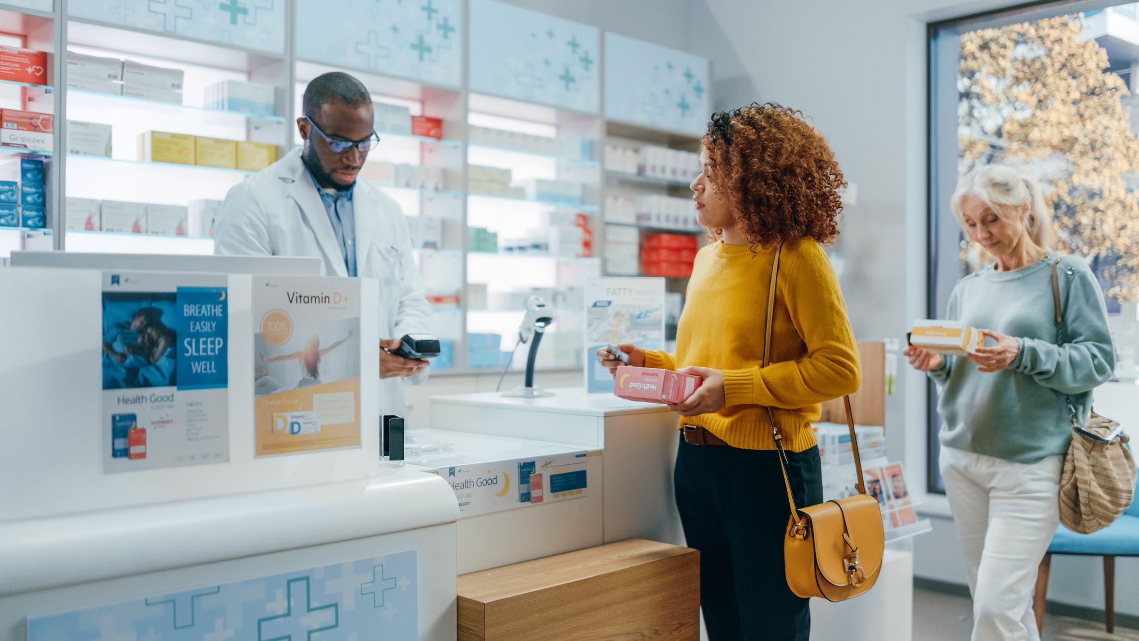 Two women waiting in line at the pharmacy