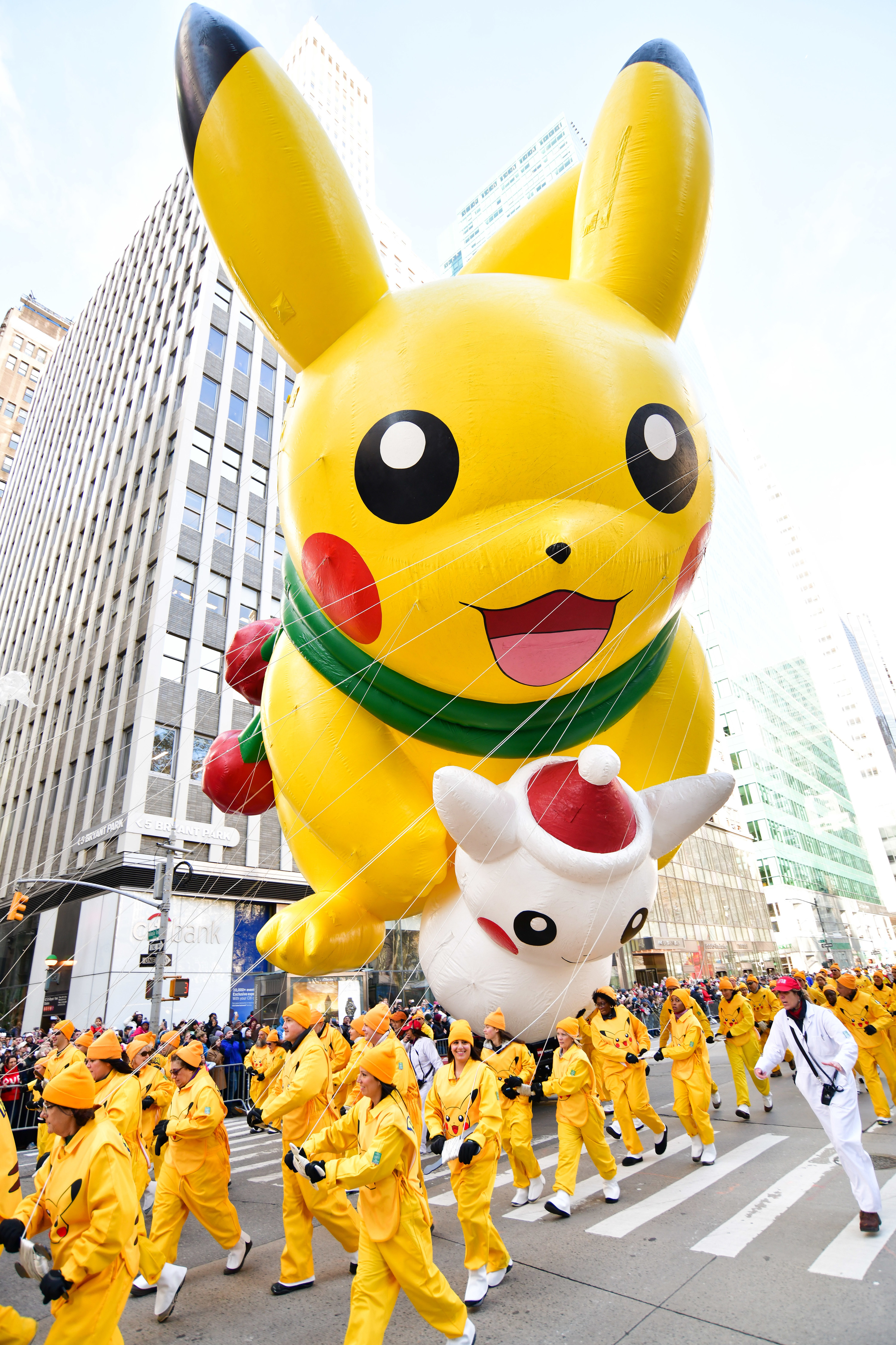 Pikachu balloon holds snowman Pikachu balloon