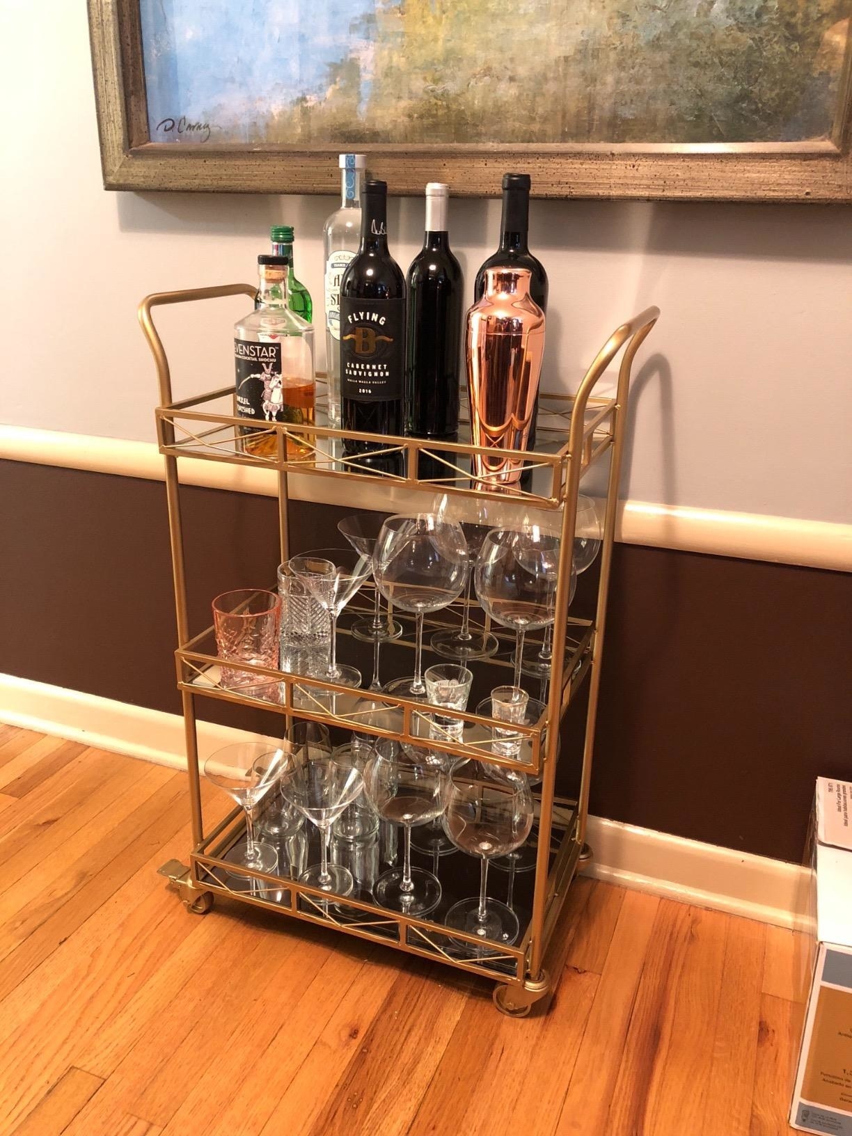 gold bar cart with glasses