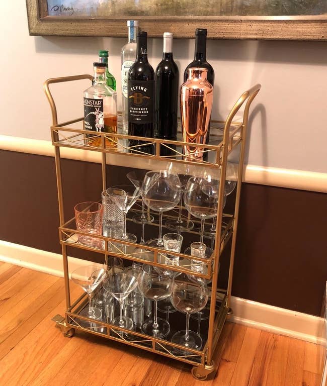 gold bar cart with glasses