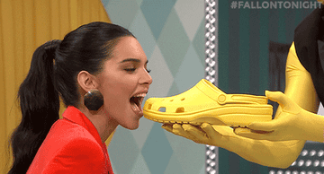 Kendall Jenner biting a Croc