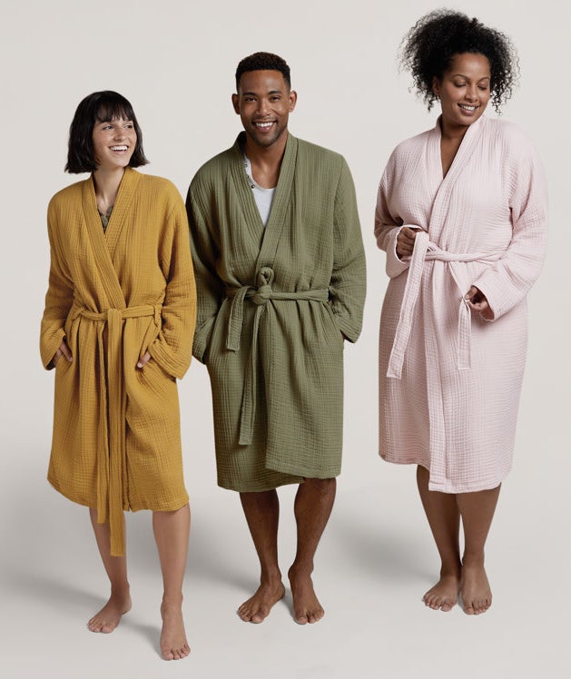 three different models wearing the robe in mustard, green, and light pink