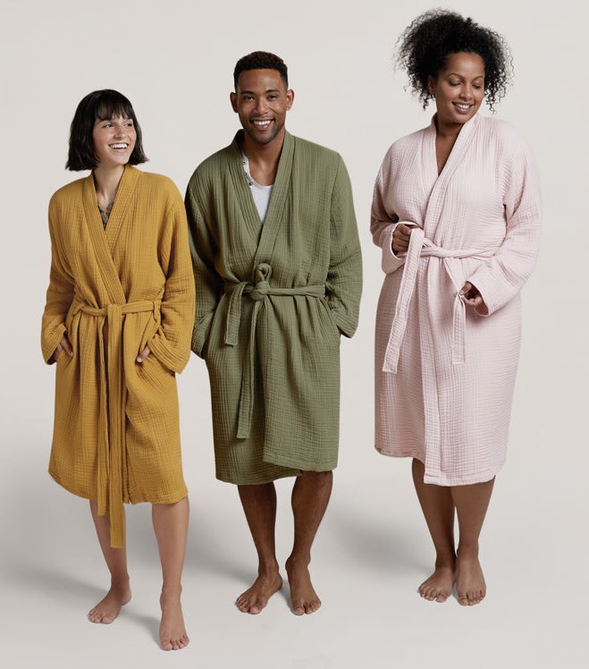 three different models wearing the robe in mustard, green, and light pink