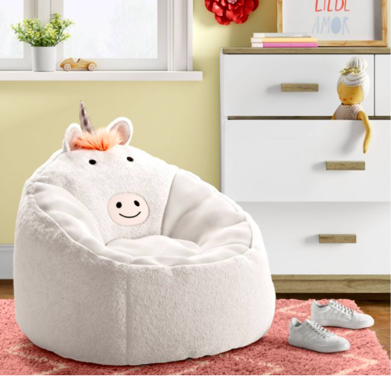 white plush chair with unicorn face and horn