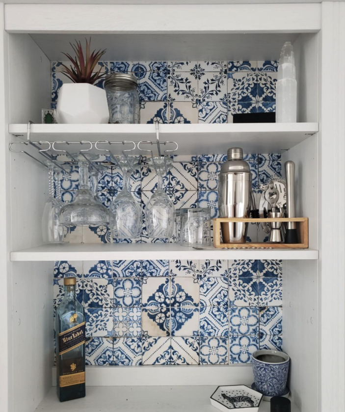 reviewer image of tiles added to the back of an IKEA cabinet that was turned into a bar cart