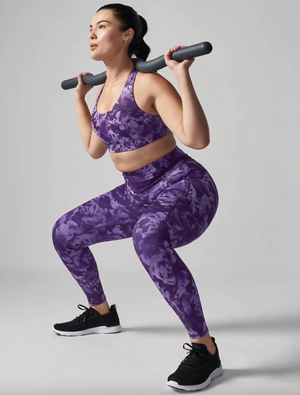model wearing tights while doing weighted squat