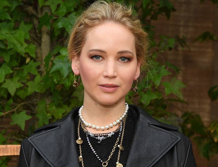Jennifer wears a leather jacket and a pearl necklace to an event