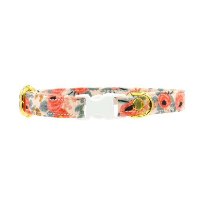 A floral-patterned cat collar.