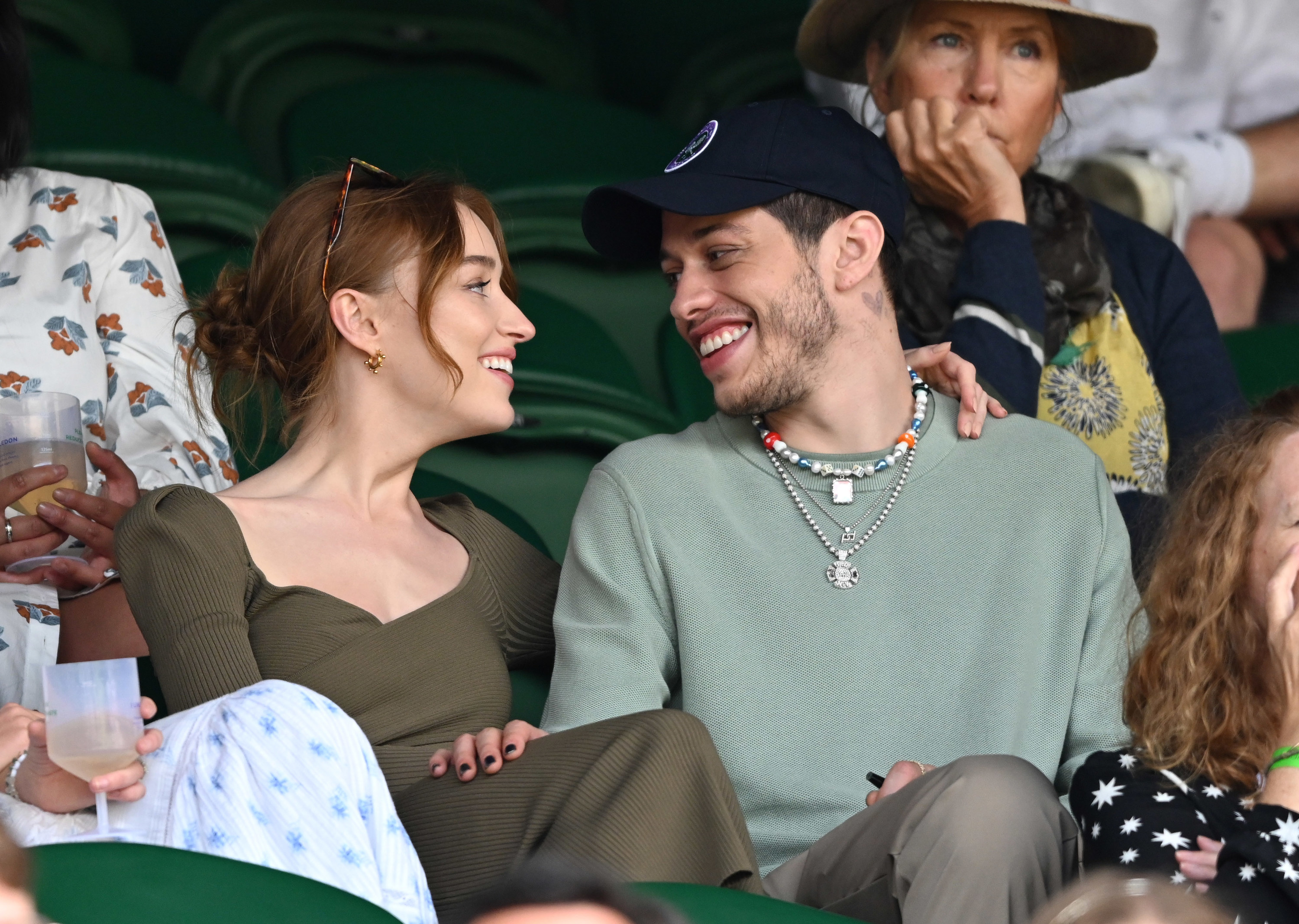 Pete looks at a former girlfriend and smiles while sitting in the crowd of an event