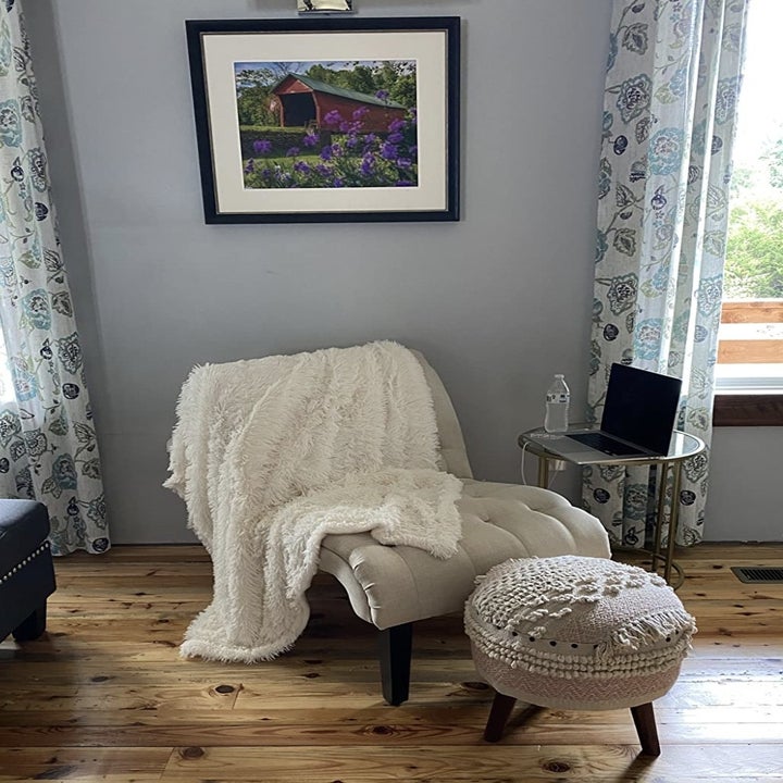 the blanket draped over a chair