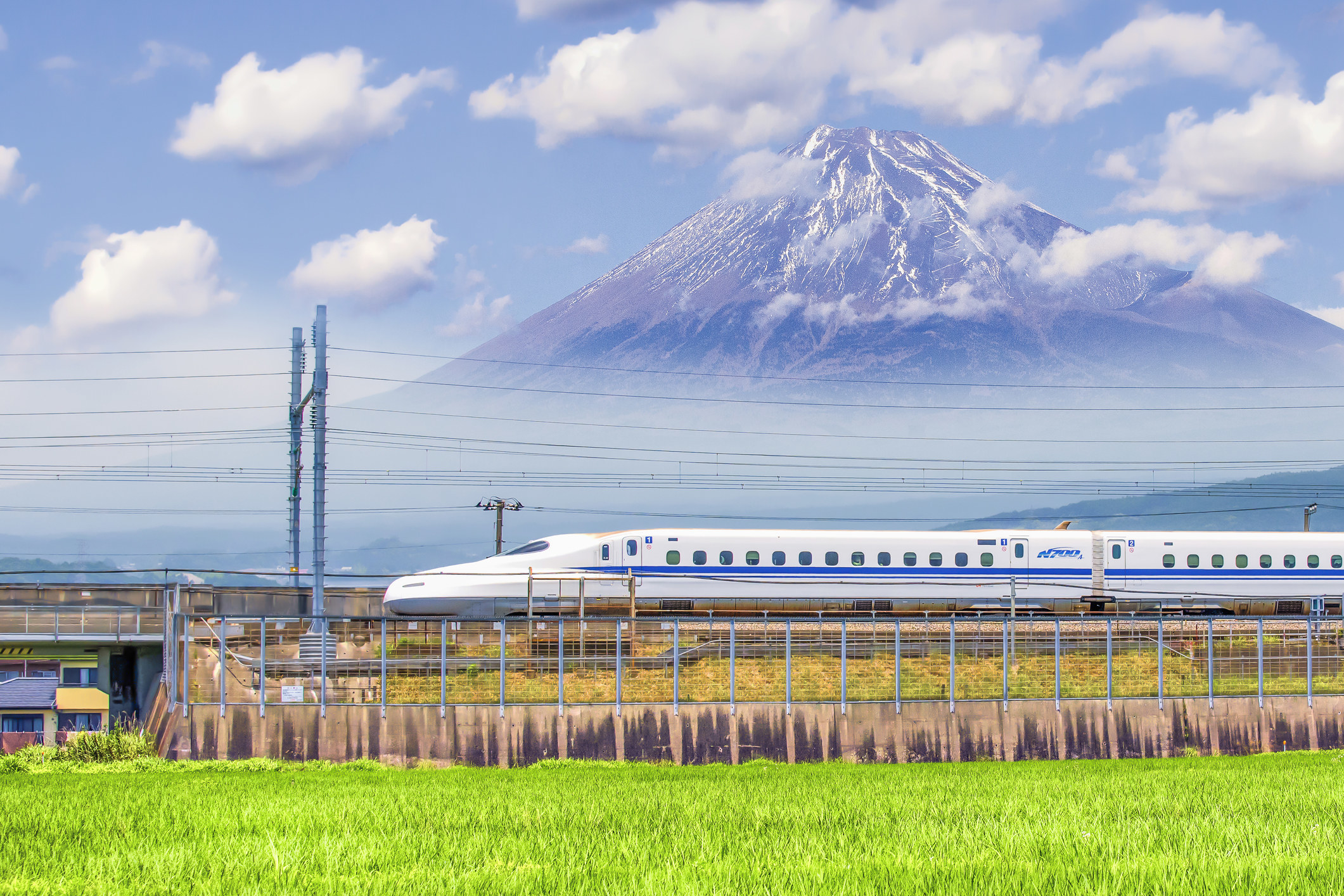A bullet train going past Mt. Fuji.