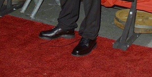 A closeup of Rupert Grint's untied shoes