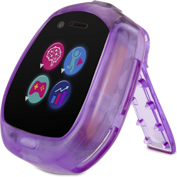 the watch off of the wristband propped using it's built in stand to display on a dresser like an alarm clock