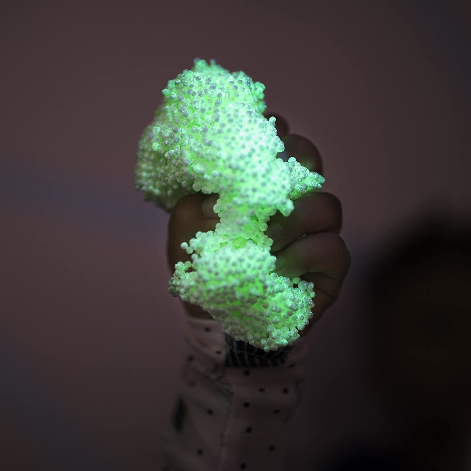 A person squishing the foam in their hand