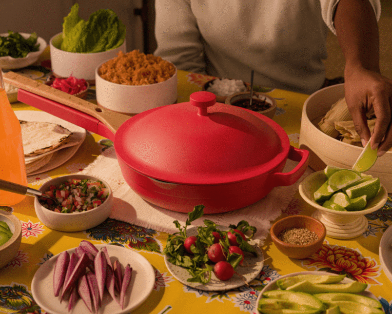 the heat colored always pan on a table covered in plated food